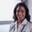 Portrait Of Female Mature Nurse In Uniform With Stethoscope In Hospital